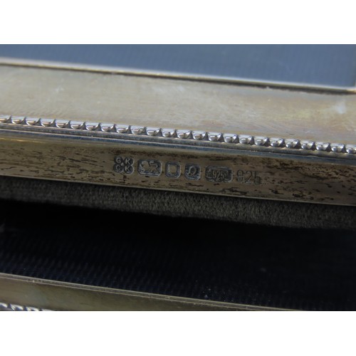 9 - A PAIR OF SILVER MOUNTED PHOTOGRAPH FRAMESwith beaded edges and easel stands(15.5 x 11.7 cm)together... 