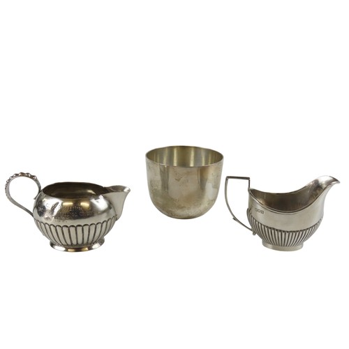 49 - TWO VICTORIAN AND EDWARDIAN SILVER CREAMERS AND A SILVER CUPboth creamers of half fluted oval form, ... 