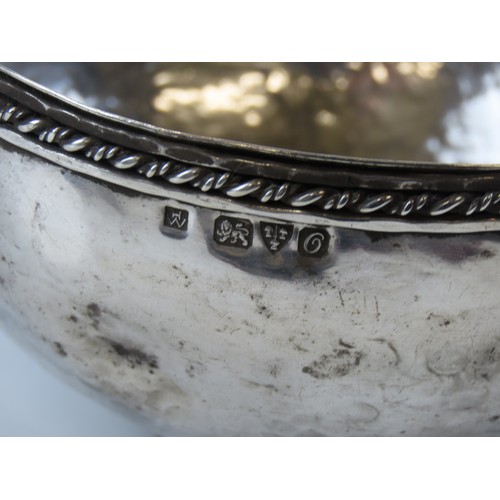19 - A GEORGE V GLOBULAR SILVER BOWLCHESTER 1914planished finish with rope twist rimmarked for Hugh Walli... 