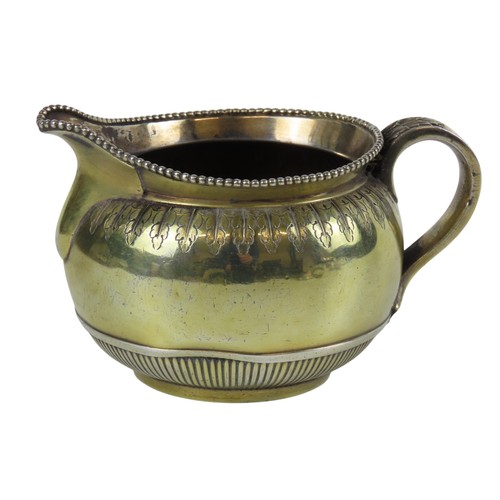 30 - A MID VICTORIAN SILVER AND GILT CREAMERLONDON 1864compressed globular form with beaded edge and flut... 