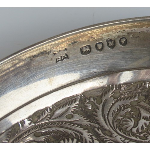 18 - A LATE VICTORIAN SILVER COVERED CUP AND SAUCERLONDON 1887the porcelain lined cup and saucer with rep... 