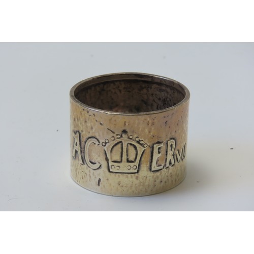 31 - A MIXED GROUP OF FOUR SILVER NAPKIN RINGSconsisting of a pair of engine turned rings and two planish... 