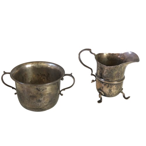 54 - A GEORGE V SILVER PORRINGERBIRMINGHAM 1924with twin 'S'-scroll handles(6.8 cm high x 9.2 cm diam, 11... 