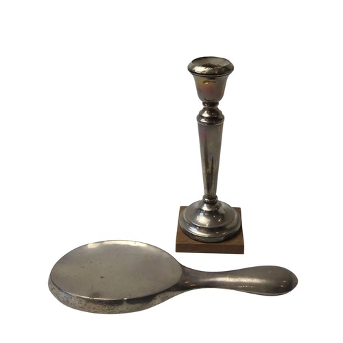 1 - A FILLED SILVER CANDLESTICK AND SILVER BACKED HAND MIRRORthe candlestick marked Birmingham, 1939 (20... 