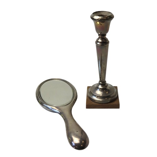 1 - A FILLED SILVER CANDLESTICK AND SILVER BACKED HAND MIRRORthe candlestick marked Birmingham, 1939 (20... 