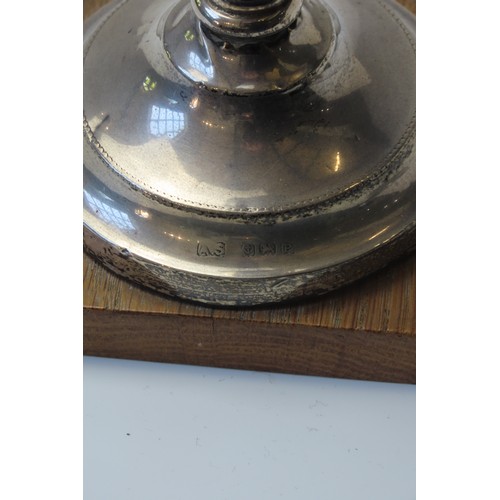 1 - A FILLED SILVER CANDLESTICK AND SILVER BACKED HAND MIRRORthe candlestick marked Birmingham, 1939 (20... 