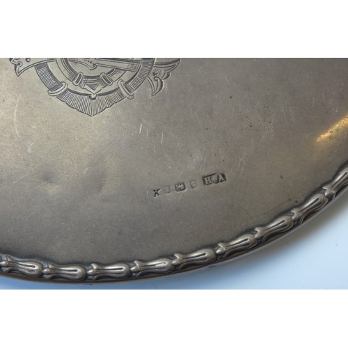 24 - THREE VINTAGE SILVER BACKED HAND MIRRORS AND FOUR BRUSHESsome monogrammed, some with repousse decora... 