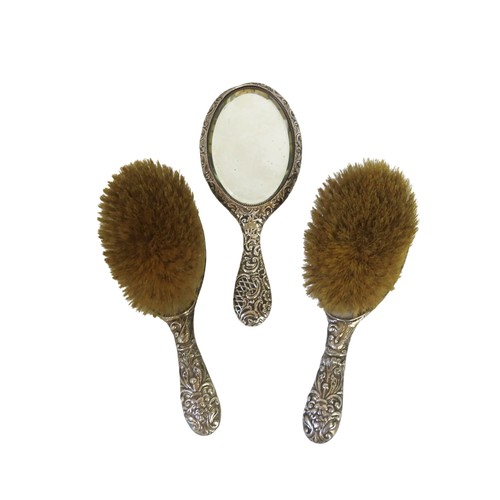 26 - A PAIR OF EDWARDIAN SILVER BACKED BRUSHESBIERMINGHAM 1907marked for W J Myatt & Co.the ornate re... 