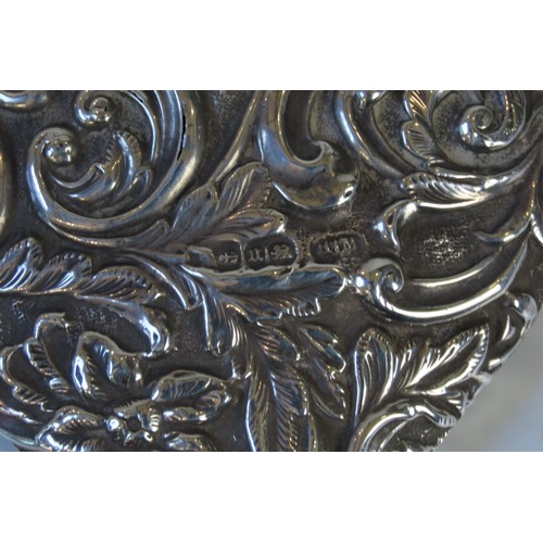 26 - A PAIR OF EDWARDIAN SILVER BACKED BRUSHESBIERMINGHAM 1907marked for W J Myatt & Co.the ornate re... 