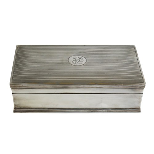 39 - A VINTAGE SILVER COVERED CIGAR BOXBIRMINGHAM 1921rectangular form with engine turned cover632 grams ... 