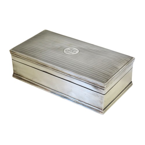 39 - A VINTAGE SILVER COVERED CIGAR BOXBIRMINGHAM 1921rectangular form with engine turned cover632 grams ... 