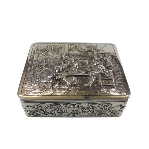 53 - A DUTCH SILVER REPOUSSE TRINKET BOXthe hinged cover with a relief tavern scene, the sides decorated ... 