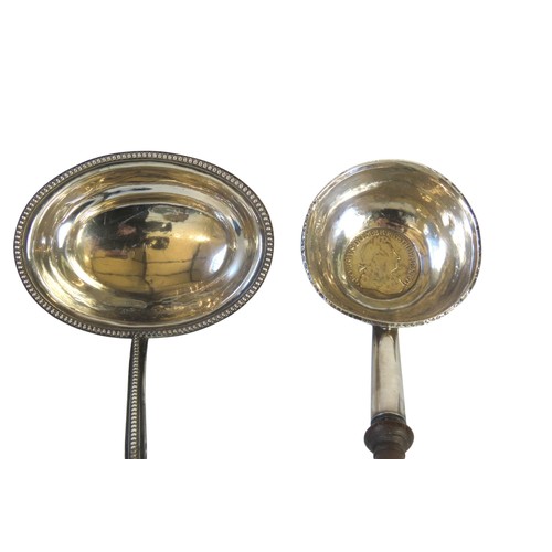 13 - TWO SILVER TODDY LADLES, one with a baleen handle and beaded edge oval bowl, the other with a turned... 