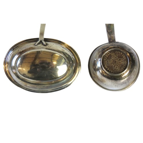 13 - TWO SILVER TODDY LADLES, one with a baleen handle and beaded edge oval bowl, the other with a turned... 
