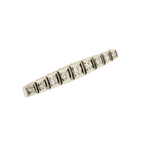 213 - A DIAMOND BROOCH, set with nine graduating brilliant cut diamonds, approximately 1.50 carats total, ... 