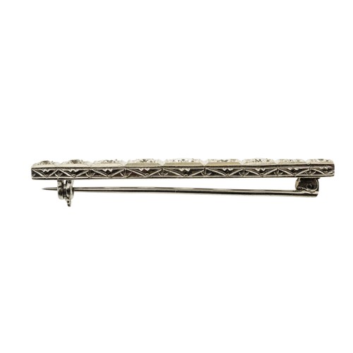 213 - A DIAMOND BROOCH, set with nine graduating brilliant cut diamonds, approximately 1.50 carats total, ... 