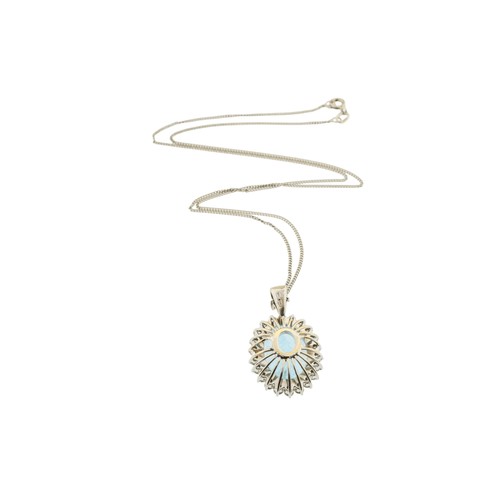 220 - AN 18 CARAT GOLD AQUAMARINE AND DIAMOND PENDANT,the oval cut aquamarine claw set within a surround o... 