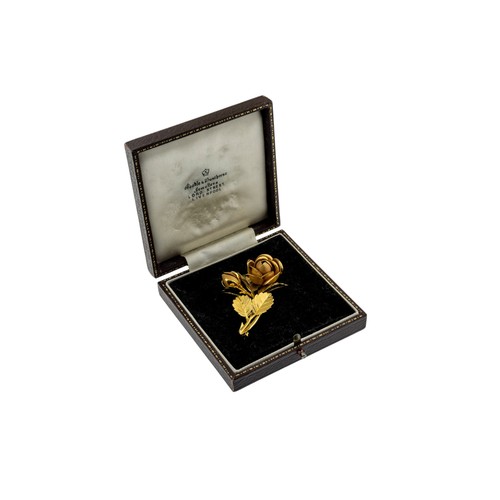 231 - AN 18 CARAT GOLD BROOCH, 1960s,designed as a budding rose, with matte finish and textured petals. St... 