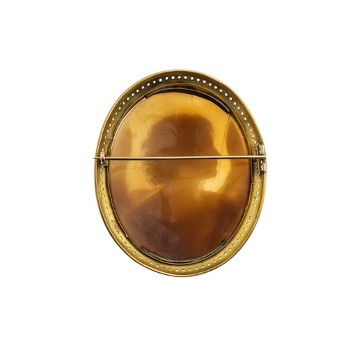 202 - A MID VICTORIAN SHELL CAMEO BROOCH, CIRCA 1870, the oval shell cameo carved with the angel Gabriel, ... 