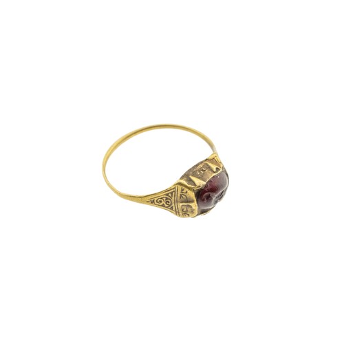 244 - AN ISLAMIC SELJUK INTAGLIO GARNET TALISMAN RING, 13th century, the oval garnet carved with a bird, w... 