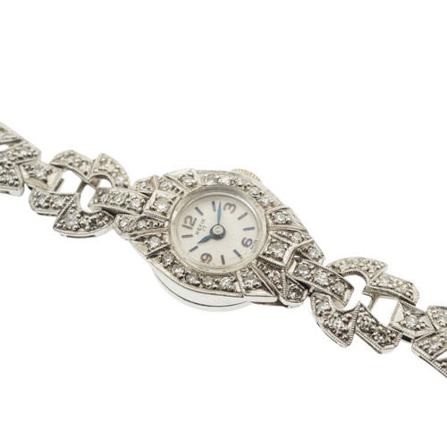 245 - HEFIK, A DIAMOND COCKTAIL WATCH, 1950s,the circular dial with Arabic numerals, baton markers and blu... 