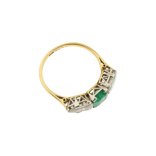 217 - AN EMERALD AND DIAMOND RING,the square shaped emerald claw set between two pear shaped diamonds.Stam... 