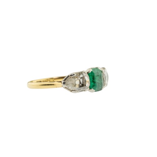 217 - AN EMERALD AND DIAMOND RING,the square shaped emerald claw set between two pear shaped diamonds.Stam... 