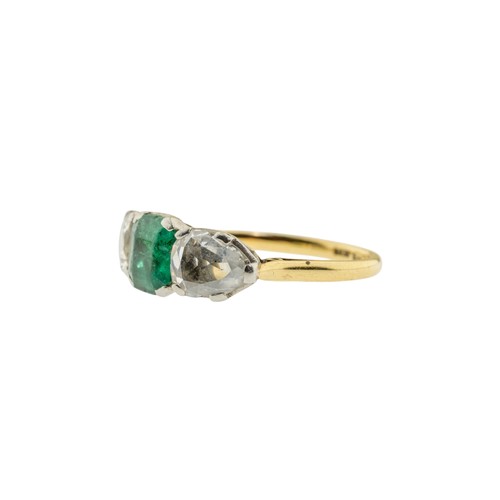 217 - AN EMERALD AND DIAMOND RING,the square shaped emerald claw set between two pear shaped diamonds.Stam... 