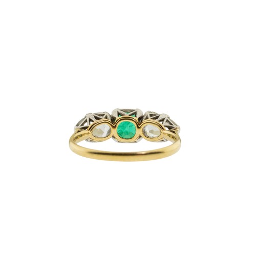 217 - AN EMERALD AND DIAMOND RING,the square shaped emerald claw set between two pear shaped diamonds.Stam... 