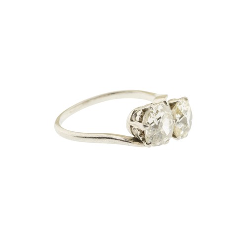 225 - A DIAMOND TWO STONE RING,set with two cushion shaped old cut diamonds, approximately 2.60 carats tot... 