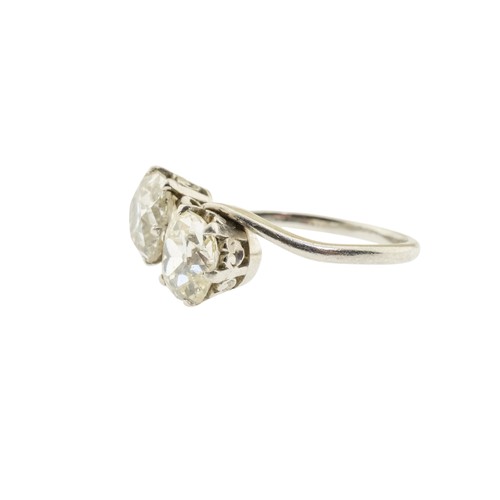 225 - A DIAMOND TWO STONE RING,set with two cushion shaped old cut diamonds, approximately 2.60 carats tot... 
