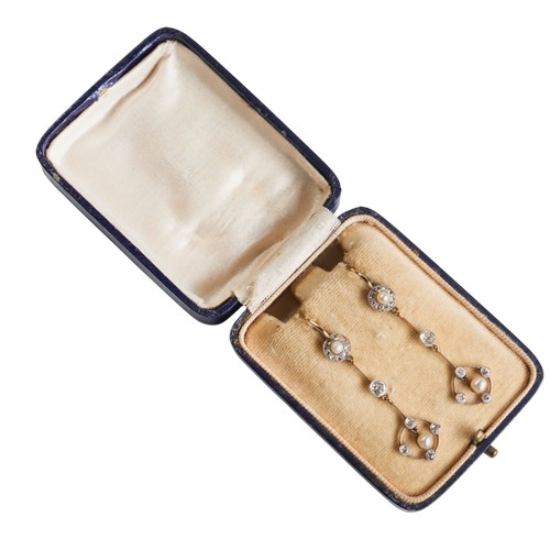 207 - A PAIR OF LATE VICTORIAN PEARL AND DIAMOND EARRINGS, CIRCA 1900,the 4mm pearls suspended within a ci... 