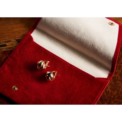 229 - A PAIR OF 18 CARAT GOLD TRINITY KNOT EARRINGS BY CARTIER, designed as tri coloured polished knots. W... 