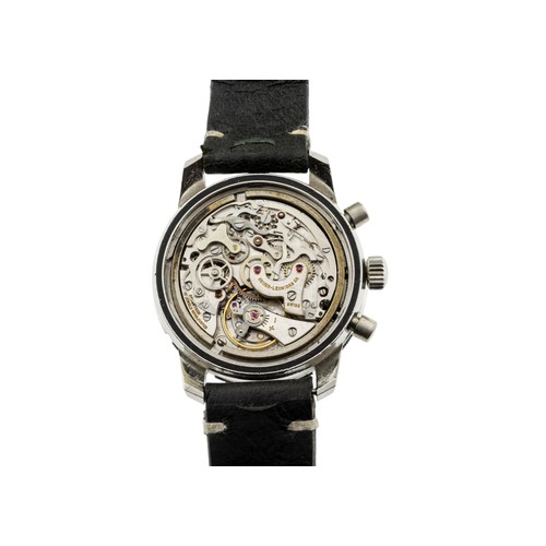 256 - HEUER: A STEEL AUTAVIA CHRONOGRAPH WRISTWATCH; Ref 2446, Serial No. 110075, reverse panda dial, sign... 