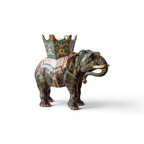 ATTRIBUTED TO DELPHIN MASSIER (1836-1907), A LARGE AND IMPRESSIVE MAJOLICA ELEPHANT FORM JARDINIERE 