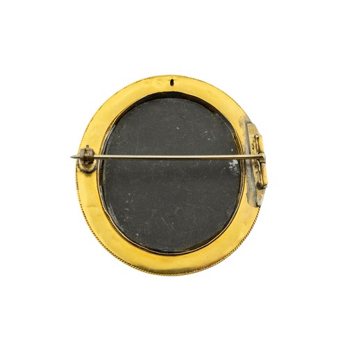 201 - A MID VICTORIAN PIETRA DURA BROOCH, CIRCA 1870,the oval black marble panel inlaid with lapis lazuli,... 