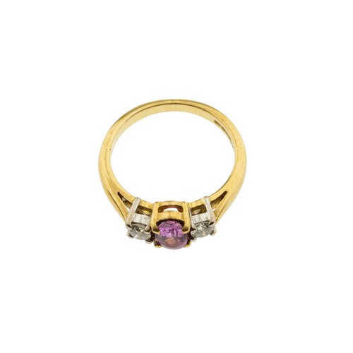 218 - A PINK SAPPHIRE AND DIAMOND RING,the oval cut pink sapphire claw set between two brilliant cut diamo... 