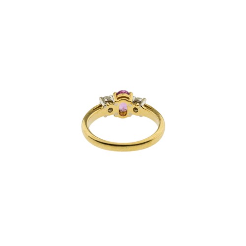 218 - A PINK SAPPHIRE AND DIAMOND RING,the oval cut pink sapphire claw set between two brilliant cut diamo... 