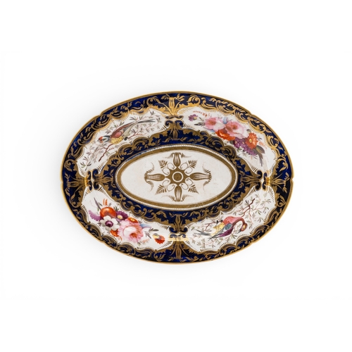 56 - A COALPORT PART SERVICE ornately decorated with birds and flowers on a dark blue ground with heavy g... 