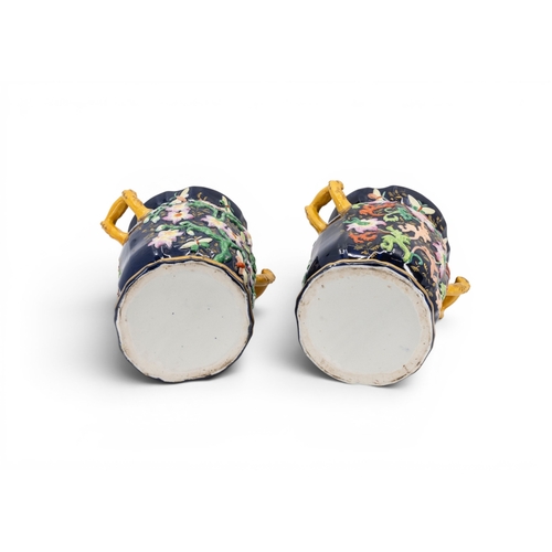 17 - A PAIR OF MASON'S VASES, boldly decorated in meandering blooms and butterflies on a blue ground with... 