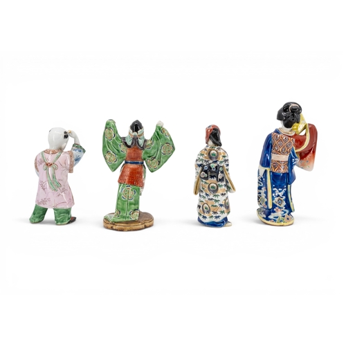 34 - FOUR JAPANESE KUTANI FIGURESLATE MEIJI / TAISHO PERIODdepicting a bijin, a musician, a boy and a pri... 