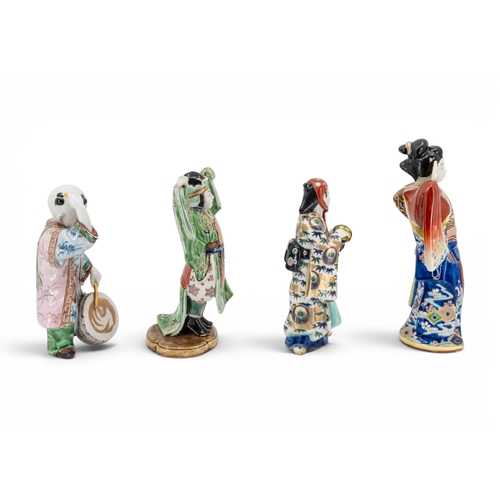 34 - FOUR JAPANESE KUTANI FIGURESLATE MEIJI / TAISHO PERIODdepicting a bijin, a musician, a boy and a pri... 