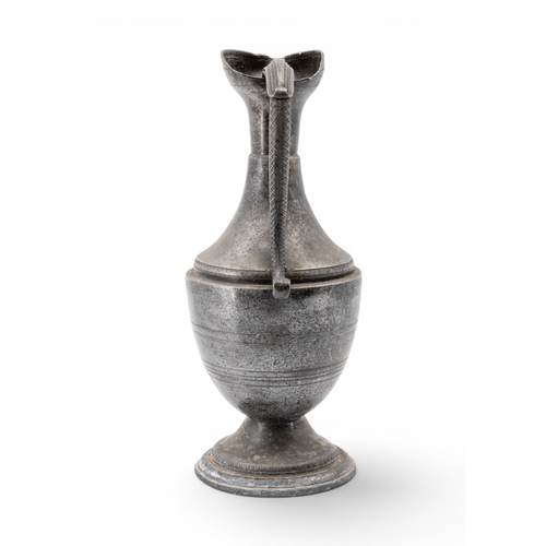58 - A FRENCH PEWTER EWER19TH CENTURYbaluster form with tricorn mouth and scrolling serpent handle, raise... 