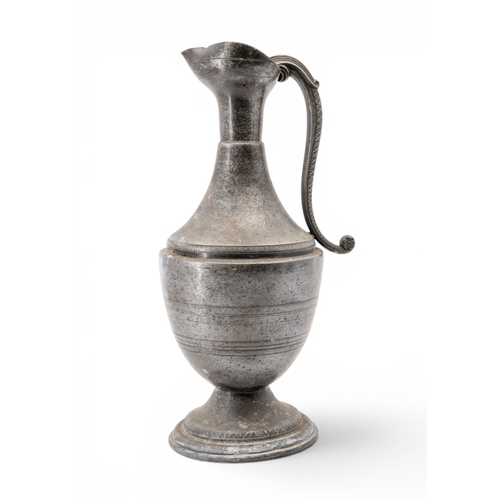 58 - A FRENCH PEWTER EWER19TH CENTURYbaluster form with tricorn mouth and scrolling serpent handle, raise... 