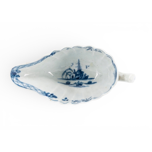 35 - LIVERPOOL BLUE AND WHITE SAUCE BOAT of lobed elongated form decorated with Chinese style scenes, mar... 