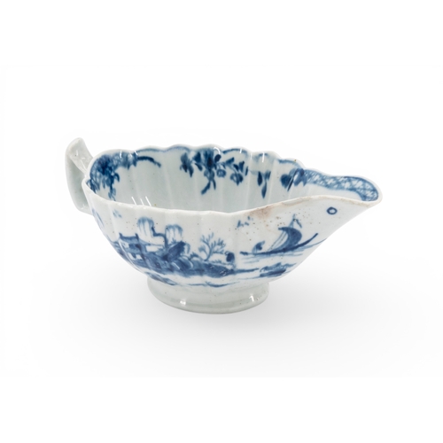 35 - LIVERPOOL BLUE AND WHITE SAUCE BOAT of lobed elongated form decorated with Chinese style scenes, mar... 