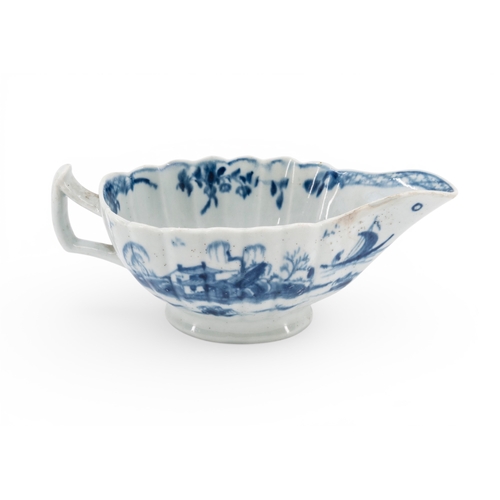 35 - LIVERPOOL BLUE AND WHITE SAUCE BOAT of lobed elongated form decorated with Chinese style scenes, mar... 