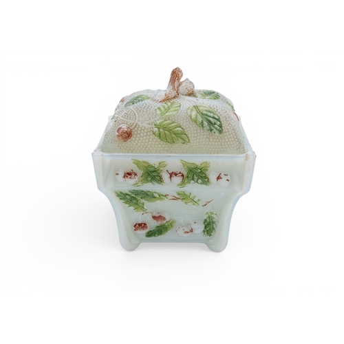 6 - A VINTAGE PRESSED GLASS BOX  decorated with cherries and cold painted. 13 x 11 x 11 cms