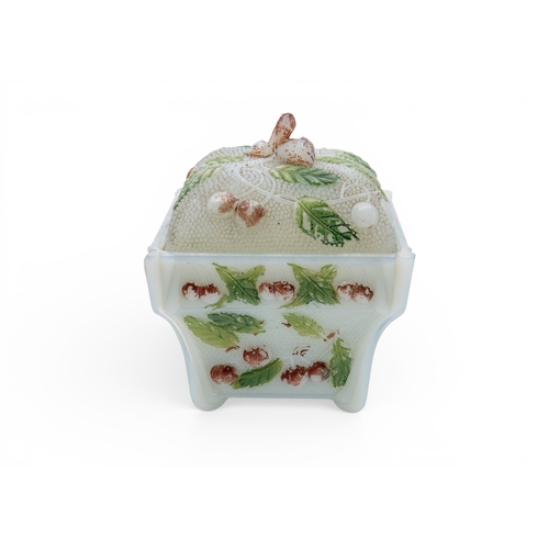 6 - A VINTAGE PRESSED GLASS BOX  decorated with cherries and cold painted. 13 x 11 x 11 cms