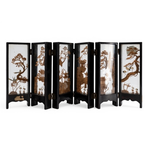 7 - A CHINESE CARVED CORK MINIATURE SIX-FOLD SCREEN20TH CENTURYthe panels carved with pagoda in mountain... 